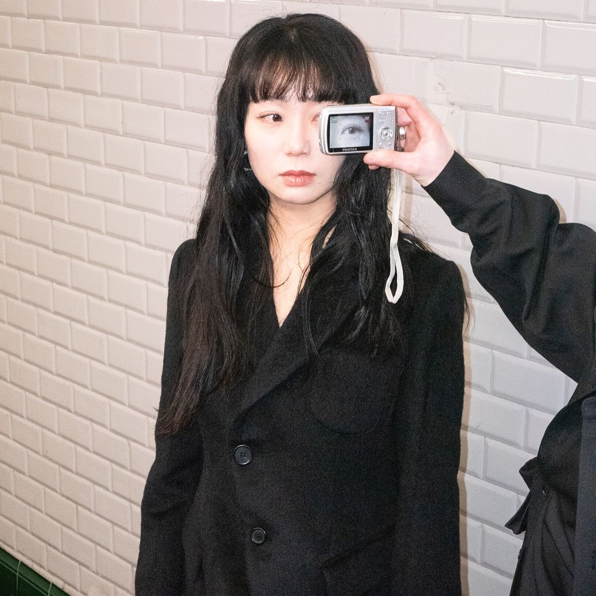 Fashion portrait with a camera