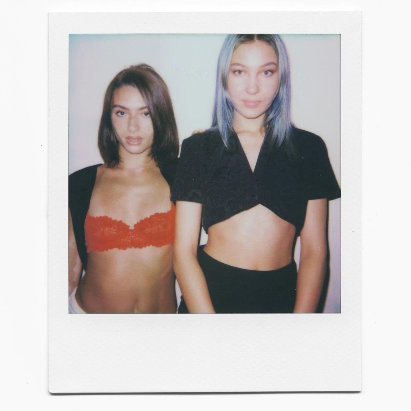 Polaroid photograph of two creators