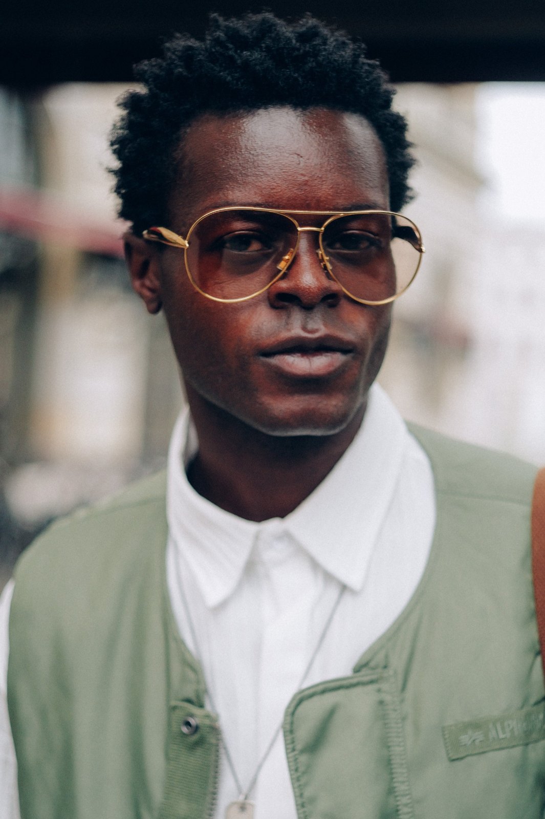 Fashion Week talent in a green suit