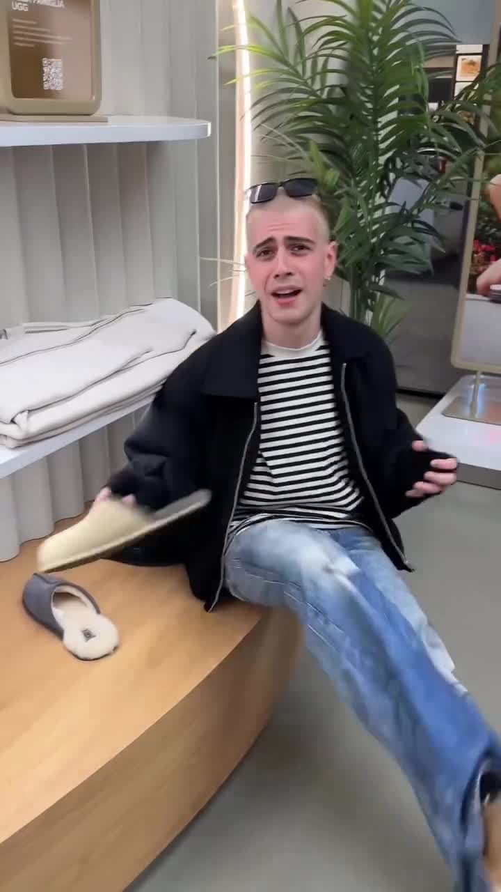 Creator sitting in a UGG store