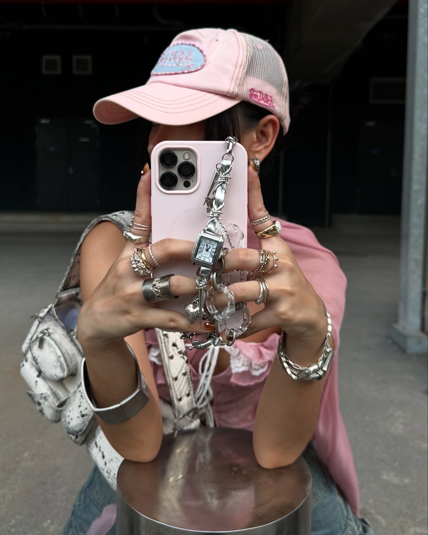 Talent styling silver jewellery in a mirror portrait