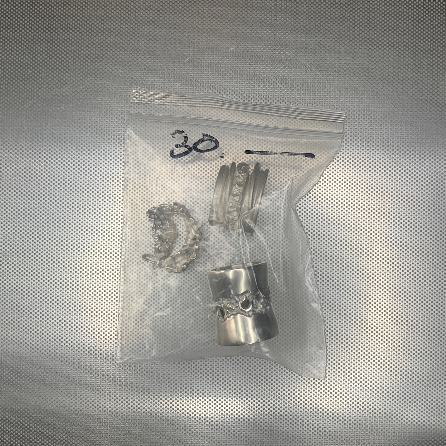 Low Temperatures silver rings in a transparent pouch